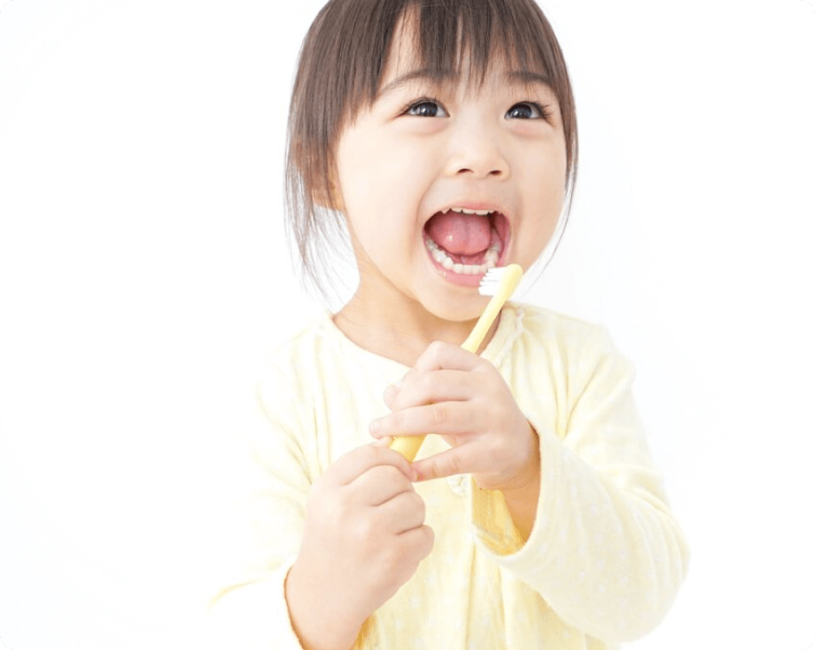 A little girl brushing her teeth